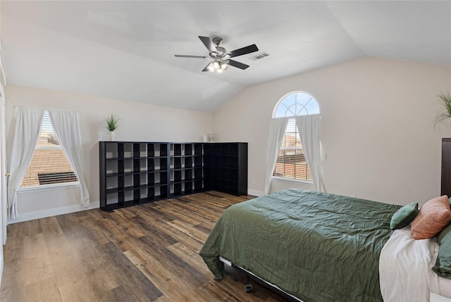 bedroom with vaulted ceiling, dark hardwood / wood-style floors, and ceiling fan