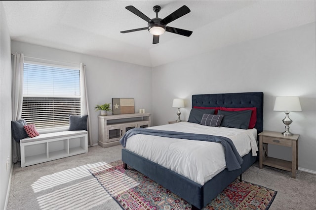 bedroom with light carpet and ceiling fan