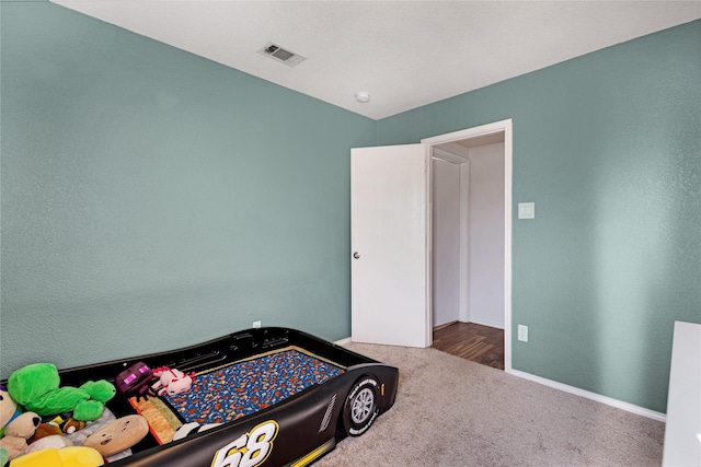 bedroom featuring carpet