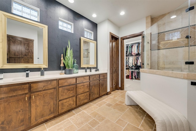 bathroom with an enclosed shower and vanity