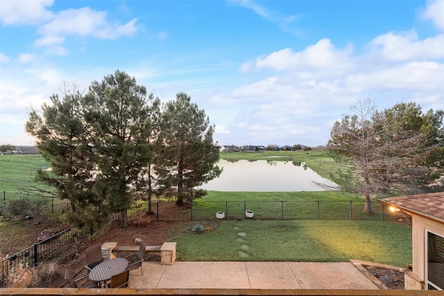 view of yard featuring a water view and a rural view