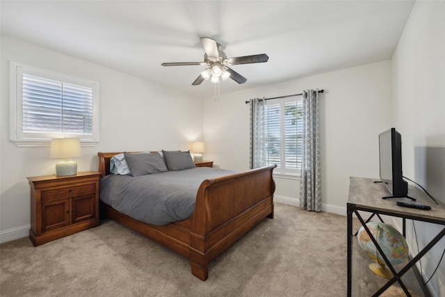 bedroom with light carpet and ceiling fan