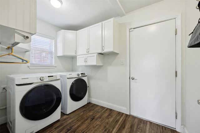 laundry area with dark hardwood / wood-style flooring, cabinets, and independent washer and dryer