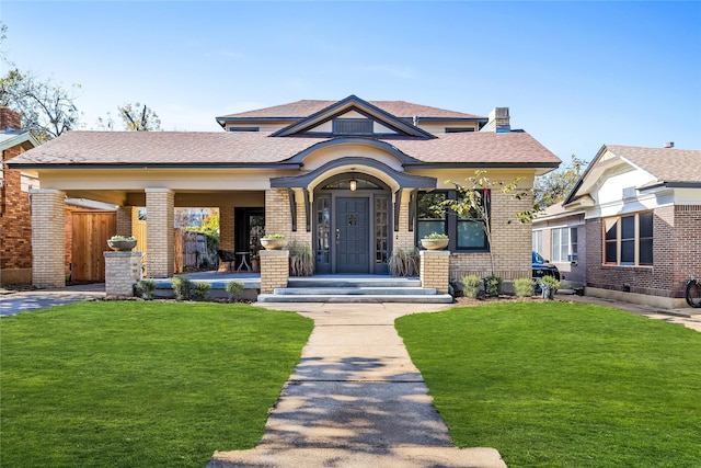 view of front of property with a front lawn