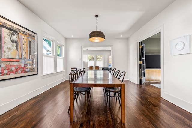 dining room with dark wood-type flooring