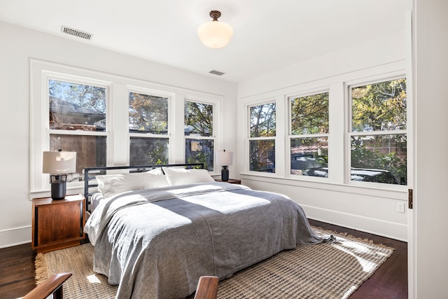 bedroom with hardwood / wood-style flooring