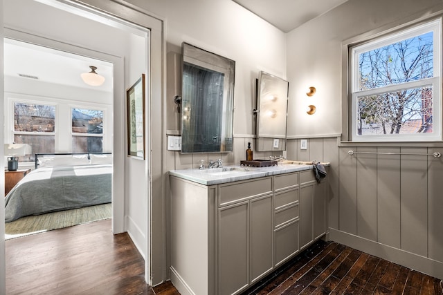 bathroom with vanity and hardwood / wood-style flooring