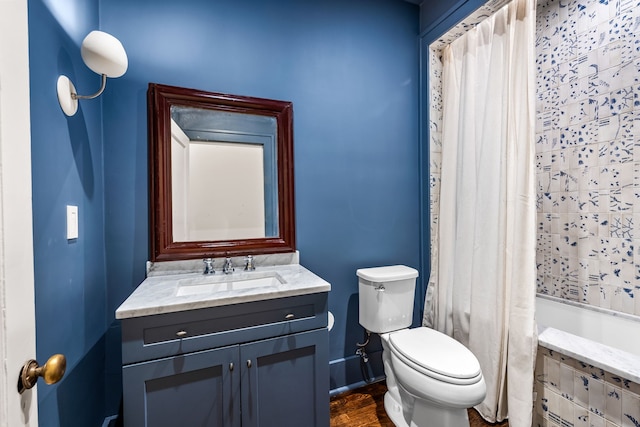 bathroom featuring hardwood / wood-style floors, vanity, and toilet