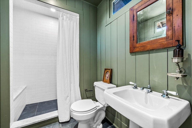 bathroom with sink, toilet, and a shower with curtain