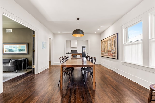 dining area featuring dark hardwood / wood-style floors