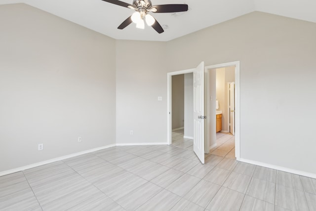 tiled spare room featuring ceiling fan and lofted ceiling