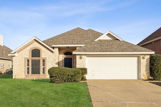 single story home with central AC unit, a front lawn, and a garage