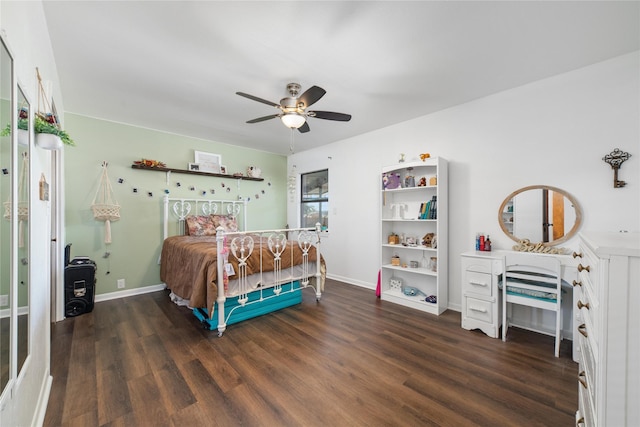 bedroom with ceiling fan and dark hardwood / wood-style floors