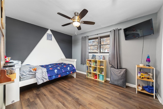 bedroom featuring ceiling fan and dark hardwood / wood-style floors