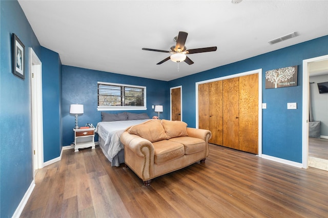 bedroom with ceiling fan and dark hardwood / wood-style floors