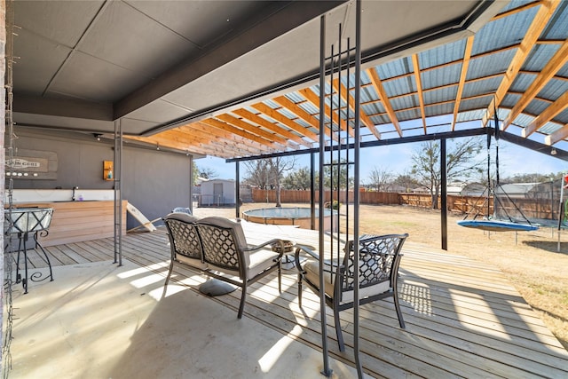 view of patio / terrace featuring a pool, an outdoor hangout area, a pergola, and a trampoline