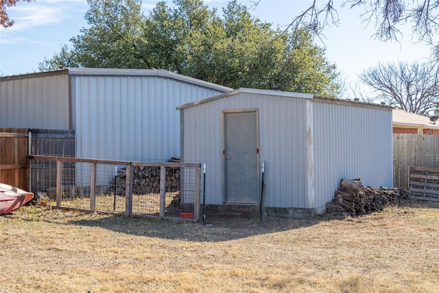 view of outdoor structure with a lawn