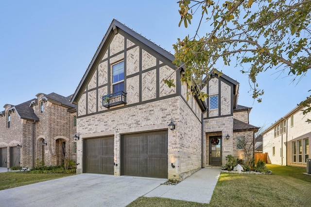 tudor-style house with cooling unit, a front lawn, and a garage