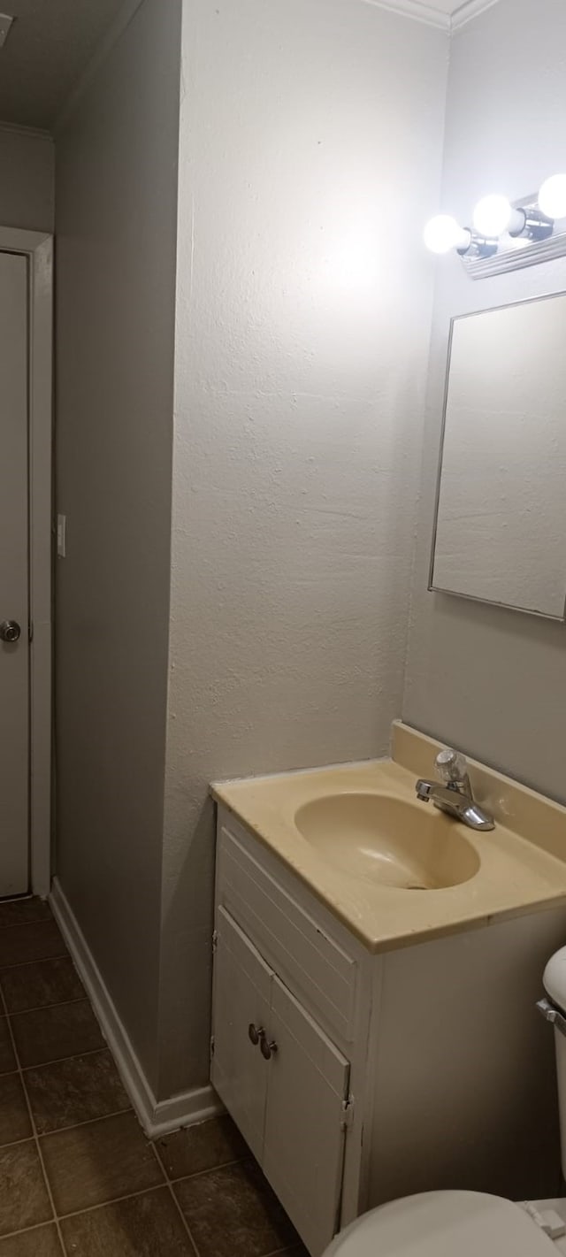 bathroom with toilet and vanity