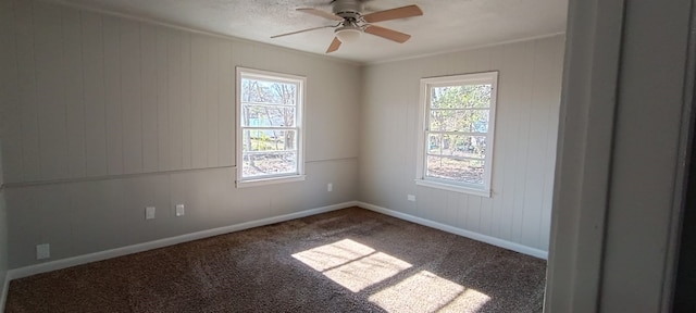 unfurnished room with ceiling fan, carpet, and ornamental molding