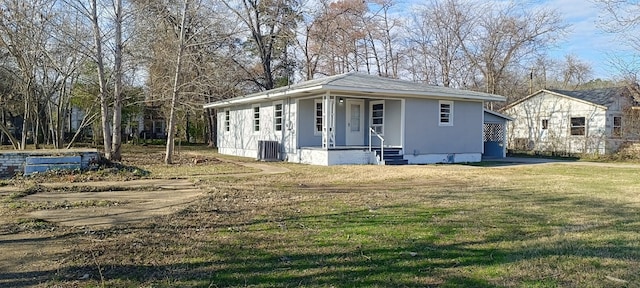 view of side of home featuring a yard and cooling unit