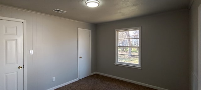 unfurnished room featuring carpet