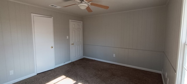 carpeted empty room with ceiling fan