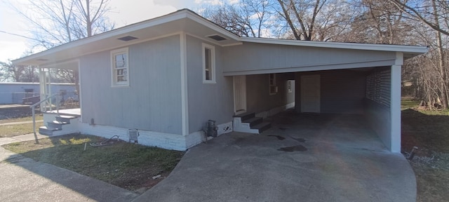 view of home's exterior with a carport