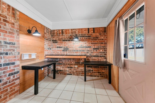 bar featuring light tile patterned floors, brick wall, and wood walls