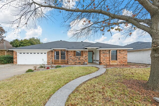 single story home featuring a front yard and a garage