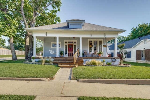 bungalow-style home with a porch and a front yard