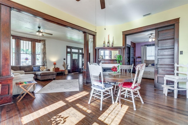 dining room featuring ceiling fan and dark wood-type flooring