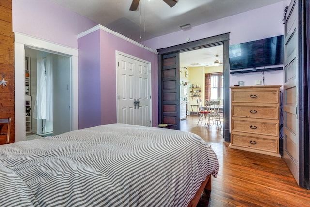 bedroom with ceiling fan and dark hardwood / wood-style floors