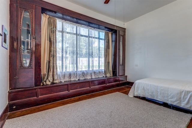 bedroom featuring ceiling fan and hardwood / wood-style flooring