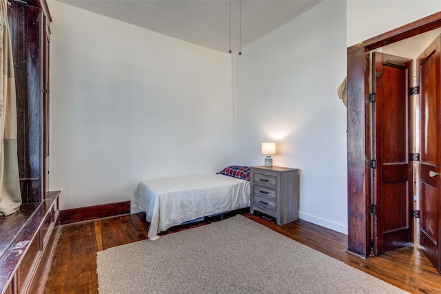 unfurnished bedroom with dark hardwood / wood-style floors