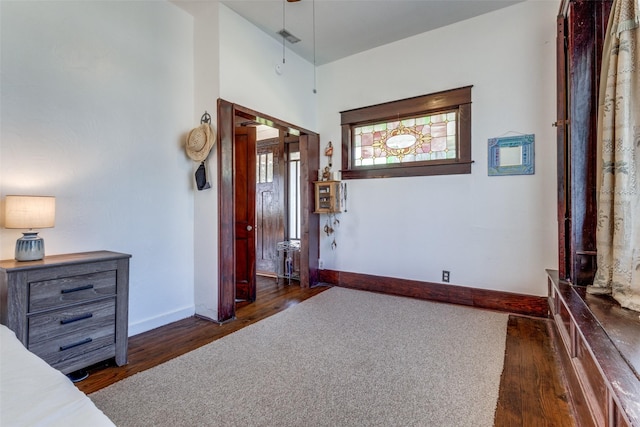 bedroom featuring dark hardwood / wood-style flooring