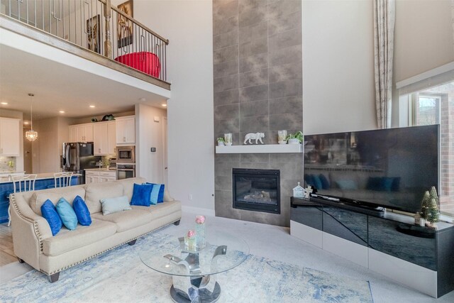 living room featuring a towering ceiling