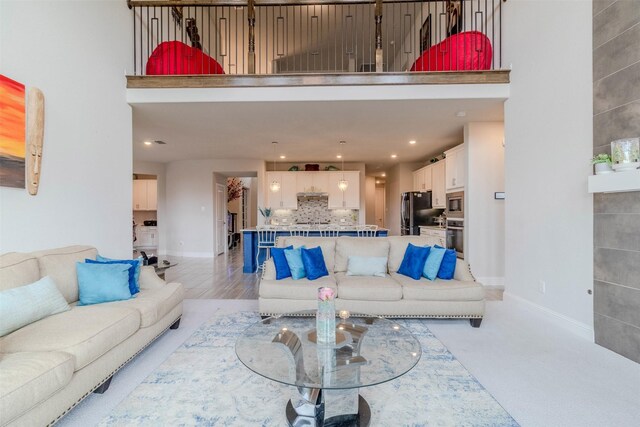 living room featuring a tiled fireplace