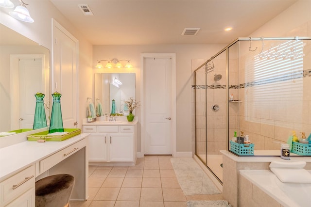 bathroom featuring an enclosed shower, vanity, and tile patterned floors