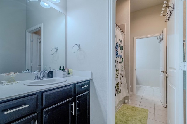 bathroom with tile patterned flooring and vanity