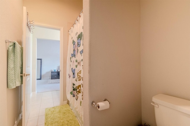 bathroom with tile patterned floors and toilet