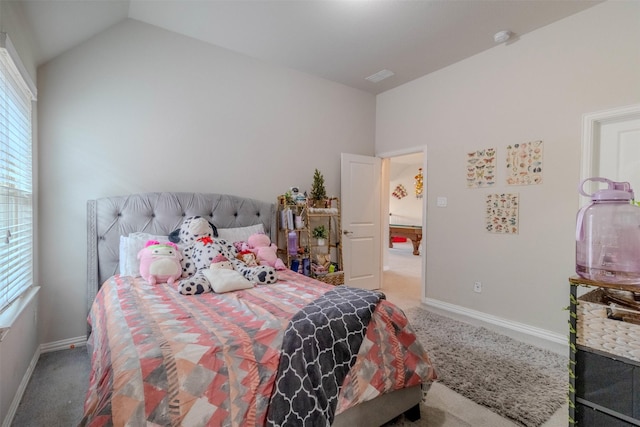 bedroom with lofted ceiling and carpet floors