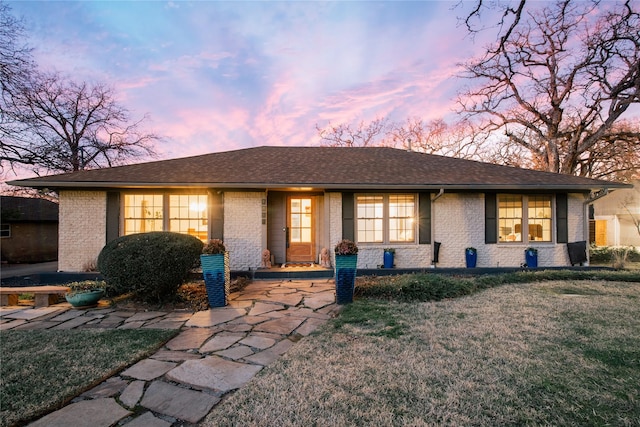 view of front of house with a yard