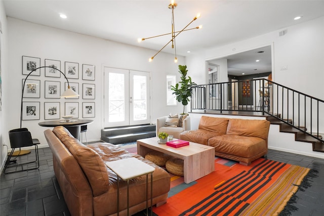 living room with a chandelier and french doors