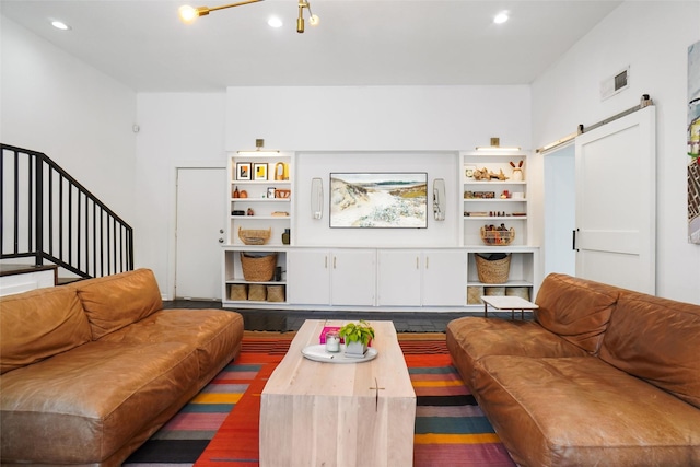 living room featuring a barn door