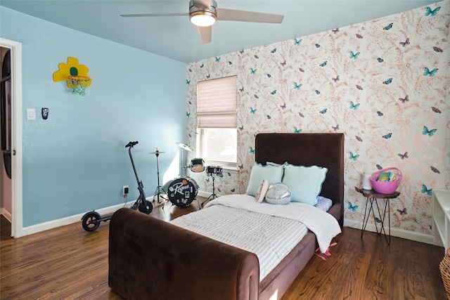 bedroom featuring ceiling fan and dark hardwood / wood-style floors