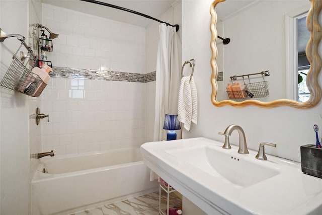 bathroom with sink and shower / tub combo