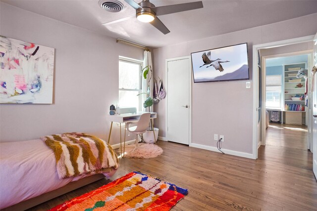 bedroom with hardwood / wood-style flooring and ceiling fan