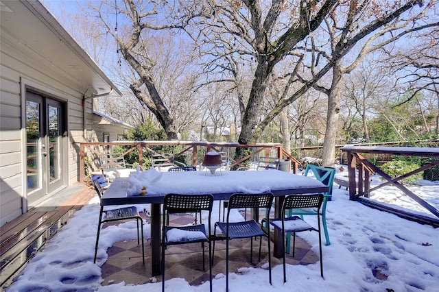 view of snow covered deck