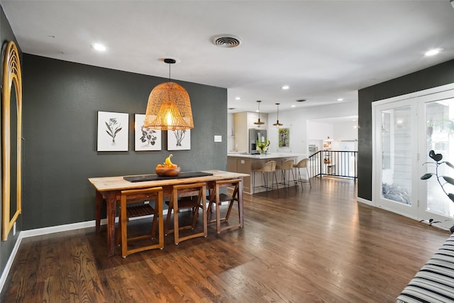 dining area featuring dark hardwood / wood-style flooring